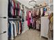 Spacious walk-in closet with ample storage, built-in shelving, and organized hanging spaces at 9084 Quail Creek Dr, Tampa, FL 33647