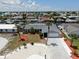 Aerial view of updated single Gathering home on a canal with lush tropical landscaping at 916 Sago Palm Way, Apollo Beach, FL 33572