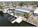 Aerial view of home with screened pool, dock and boat lift on canal at 916 Sago Palm Way, Apollo Beach, FL 33572