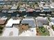 Beautiful aerial view of a neighborhood with waterfront homes, docks, and boat lifts along a canal at 916 Sago Palm Way, Apollo Beach, FL 33572