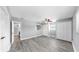 Bright bedroom with gray plank flooring, a ceiling fan, and double closets at 916 Sago Palm Way, Apollo Beach, FL 33572