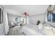 Calm bedroom with ceiling fan, neutral color scheme, and serene decor for ultimate relaxation at 916 Sago Palm Way, Apollo Beach, FL 33572