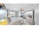 Bright bedroom with hardwood floors, ceiling fan, and en-suite bathroom at 916 Sago Palm Way, Apollo Beach, FL 33572