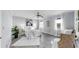 Bright bedroom with hardwood floors, ceiling fan, and ample natural light at 916 Sago Palm Way, Apollo Beach, FL 33572