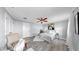 Serene bedroom showcases a ceiling fan, neutral walls, and stylish decor for ultimate relaxation at 916 Sago Palm Way, Apollo Beach, FL 33572