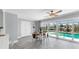 Dining area features neutral decor and views of the canal and swimming pool at 916 Sago Palm Way, Apollo Beach, FL 33572