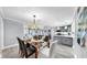 Charming dining room with open layout to the kitchen and living areas at 916 Sago Palm Way, Apollo Beach, FL 33572