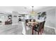 Open-concept dining area flows into the kitchen and living room with stylish decor at 916 Sago Palm Way, Apollo Beach, FL 33572