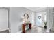 Welcoming entryway with modern decor and light grey wood-look floors at 916 Sago Palm Way, Apollo Beach, FL 33572