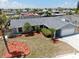 Aerial view of home with mature landscaping and lawn at 916 Sago Palm Way, Apollo Beach, FL 33572