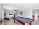 Spacious game room featuring a pool table and neutral decor and flooring at 916 Sago Palm Way, Apollo Beach, FL 33572