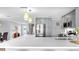 Bright, open concept kitchen featuring stainless steel appliances and ample counter space at 916 Sago Palm Way, Apollo Beach, FL 33572