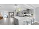 Open concept: Modern kitchen featuring stainless steel appliances and a breakfast bar at 916 Sago Palm Way, Apollo Beach, FL 33572
