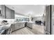 Modern kitchen overlooking dining area, equipped with stainless appliances and white countertops at 916 Sago Palm Way, Apollo Beach, FL 33572