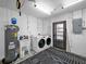 Spacious laundry room with modern appliances and ample storage, enhancing convenience at 916 Sago Palm Way, Apollo Beach, FL 33572