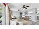 Bright living room features neutral tones, ceiling fans, and plenty of natural light at 916 Sago Palm Way, Apollo Beach, FL 33572