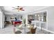 Spacious living area with dining table, pool table and modern kitchen area with counter seating at 916 Sago Palm Way, Apollo Beach, FL 33572