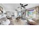 Bright and airy living room with a cozy seating area and large windows at 916 Sago Palm Way, Apollo Beach, FL 33572