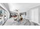 Open living area includes pool table, dining area, and kitchen with access to the pool at 916 Sago Palm Way, Apollo Beach, FL 33572