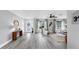 Open concept living space features light gray wood-look floors and abundant natural light at 916 Sago Palm Way, Apollo Beach, FL 33572