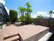 Exterior patio features brick pavers, lush palms, and a serene backyard setting along the water at 916 Sago Palm Way, Apollo Beach, FL 33572