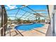 Enjoy the beautiful pool area in this screened-in lanai with pavers and tropical landscaping at 916 Sago Palm Way, Apollo Beach, FL 33572