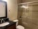 The renovated bathroom offers a glass shower, sleek vanity, and modern fixtures at 9481 Highland Oak Dr # 814, Tampa, FL 33647