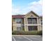 Inviting condo showcasing a charming balcony with a beige exterior paint scheme at 9481 Highland Oak Dr # 814, Tampa, FL 33647
