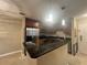 Well-lit kitchen featuring stainless steel appliances and stylish granite countertops at 9481 Highland Oak Dr # 814, Tampa, FL 33647