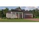 Charming single-story home featuring a welcoming front porch, a two-car garage, and a beautifully landscaped lawn at 9545 Minnow Ray Dr, Land O Lakes, FL 34638