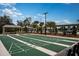 This shuffleboard court area has multiple courts and seating under a pavilion at 9545 Minnow Ray Dr, Land O Lakes, FL 34638