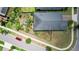 An aerial view of the home's roof, back yard, and surrounding neighborhood, highlighting its location at 9931 Victory Gallop Loop, Ruskin, FL 33573