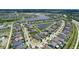 Expansive aerial view of a neighborhood showcasing well-maintained homes, lush landscaping, and serene water features at 9931 Victory Gallop Loop, Ruskin, FL 33573