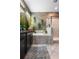 Modern bathroom with a soaking tub, tiled shower, and stone accent wall at 9931 Victory Gallop Loop, Ruskin, FL 33573