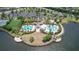 Aerial view showcasing community pool and recreation area with well-kept landscaping and clear water views at 9931 Victory Gallop Loop, Ruskin, FL 33573