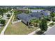 Beautifully landscaped home with a well-maintained lawn, palm trees, and a fenced yard, offering privacy and curb appeal at 9931 Victory Gallop Loop, Ruskin, FL 33573