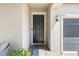 Welcoming front entry with a black door and brick paver walkway at 9931 Victory Gallop Loop, Ruskin, FL 33573