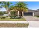 Charming single-Gathering home with well-manicured landscaping and a brick driveway at 9931 Victory Gallop Loop, Ruskin, FL 33573