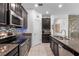 Well-equipped kitchen featuring granite countertops, modern appliances, and ample cabinet space at 9931 Victory Gallop Loop, Ruskin, FL 33573