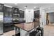 Charming kitchen with granite counters, stainless appliances, and a functional center island at 9931 Victory Gallop Loop, Ruskin, FL 33573