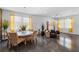Open living space with decorative stone wall feature, bright windows, and modern furnishings at 9931 Victory Gallop Loop, Ruskin, FL 33573