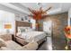 Main bedroom featuring a seating area, decorative accent wall, and large mirror at 9931 Victory Gallop Loop, Ruskin, FL 33573