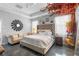 Cozy main bedroom featuring a tufted headboard, sitting area and decorative accent wall at 9931 Victory Gallop Loop, Ruskin, FL 33573