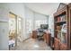 Bright office space with built-in shelving, sliding doors, and a window to the yard at 1007 English Bluffs Ct, Brandon, FL 33511