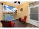 Relaxing balcony featuring seating with a view of the community tennis courts at 10764 70Th Ave # 5302, Seminole, FL 33772