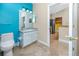 Bathroom with adjacent kitchen with stainless steel appliances at 10764 70Th Ave # 5302, Seminole, FL 33772