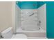 Bathroom features a shower and tub combo with blue accent wall at 10764 70Th Ave # 5302, Seminole, FL 33772