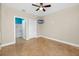 Cozy bedroom showcasing tile floors, a ceiling fan, and convenient access to the bathroom at 10764 70Th Ave # 5302, Seminole, FL 33772