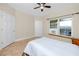 Bedroom features a ceiling fan, tile flooring, and access to outdoor deck at 10764 70Th Ave # 5302, Seminole, FL 33772