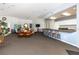 Spacious community room with seating, bar area, and a TV, perfect for social gatherings and events at 10764 70Th Ave # 5302, Seminole, FL 33772